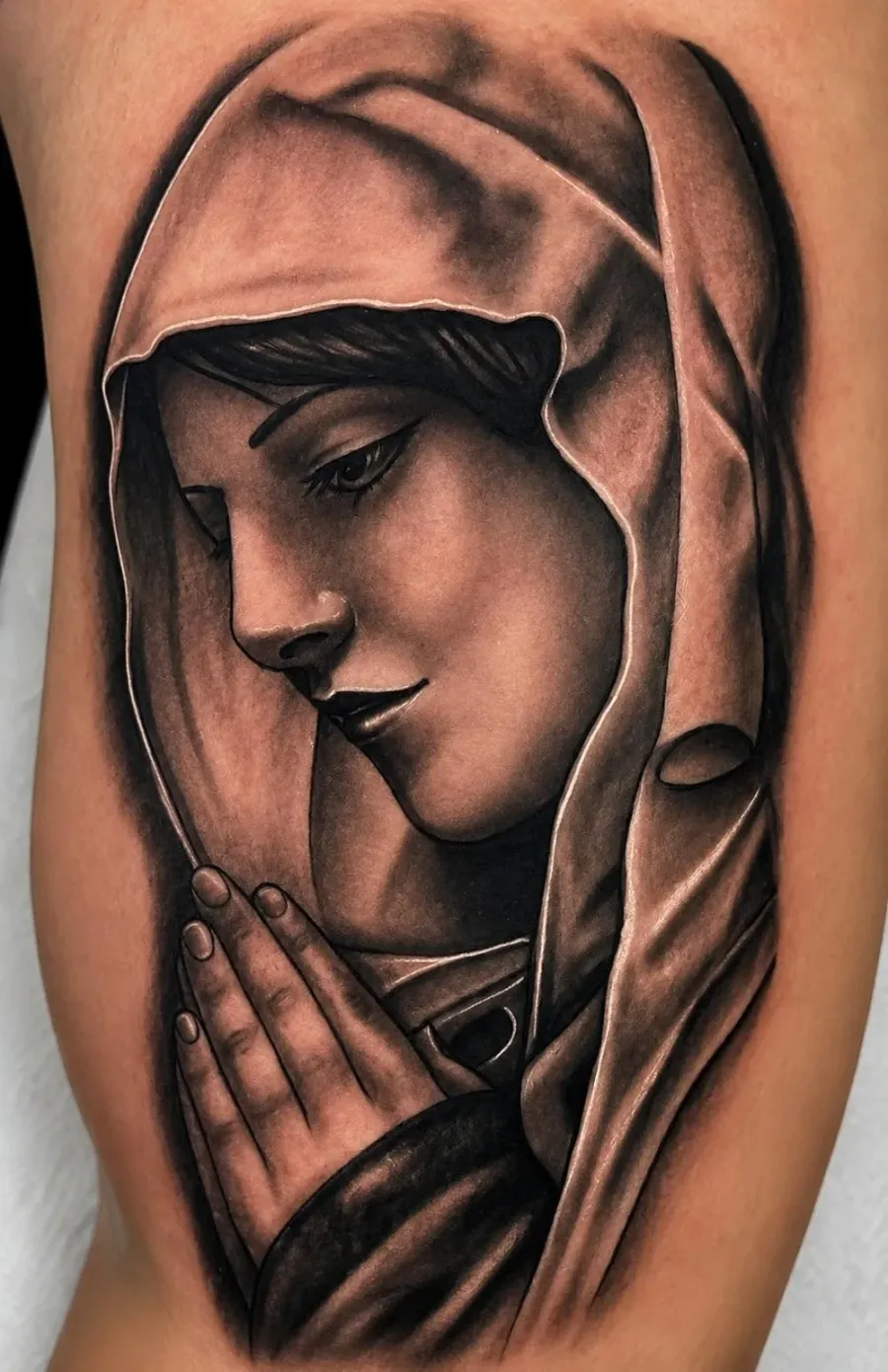Black and grey religious Madonna portrait tattoo with smooth shading by Ivan Todorov at N9 Tattoo, Edmonton, North London