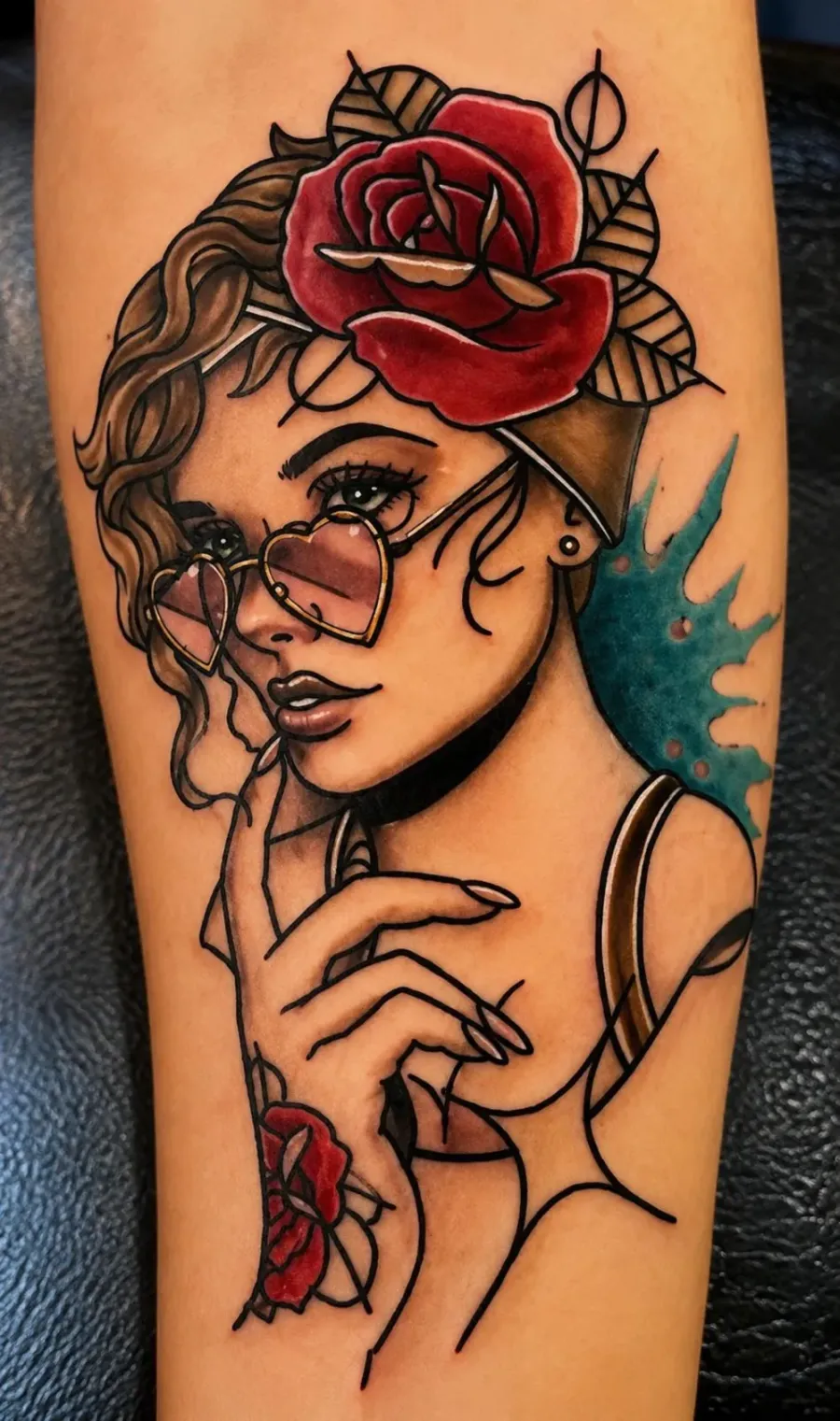Neo-traditional colour tattoo of a woman with a red rose and heart sunglasses, bold outlines, N9 Tattoo Edmonton